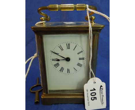 Small French brass carriage clock with full depth enamel dial and key.