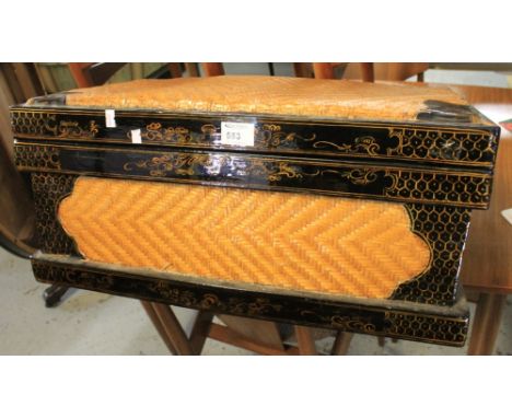 Gilt and lacquered wicker trunk. CONDITION REPORT: Modern. Some damage to caning. Fair condition.