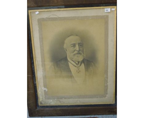 Framed photographic portrait of a gentleman.