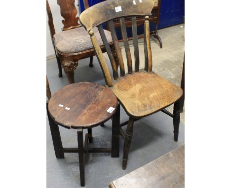 Stained elm slat back farmhouse kitchen chair together with a small stained circular stool. (2)