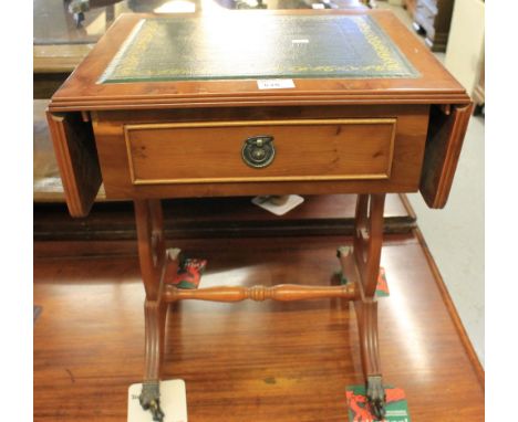 Reproduction yew wood single drawer sofa type table with leather inset top.