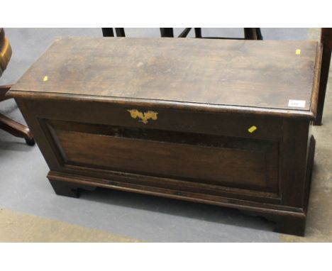 Oak and elm small coffer with moulded fielded panel on bracket feet.