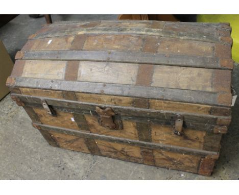 Vintage domed top brass and wooden banded travelling trunk.