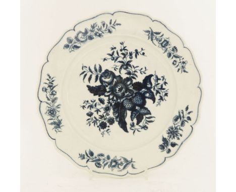 A large blue and white Worcester plate,c.1780, printed in 'The Pine Cone Group' pattern, hatched crescent mark,30cm diameter