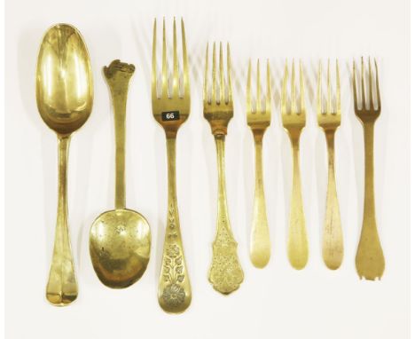 Eight early base metal cutlery items,including:a 17th century brass spoon with trefid end and maker's mark,16.5cm,a four-pron
