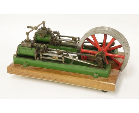 A model horizontal twin-pump steam engine,in green livery, mounted on an hardwood base,34cm long