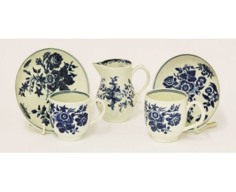 Worcester blue and white porcelain,c.1780, two cups and saucers printed in 'The Three Flowers' pattern, anda sparrow beak jug