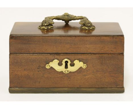 A George III mahogany tea caddy, the plain surface with a cast handle, opening to reveal three tin lidded containers, 17cm wi