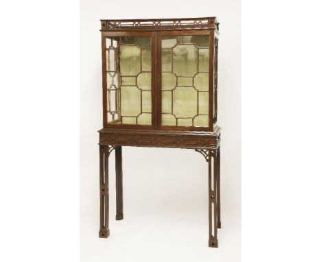 An mahogany Chippendale-type display cabinet,18th century, the pierced galleried top over astragal glazed doors, the lower se