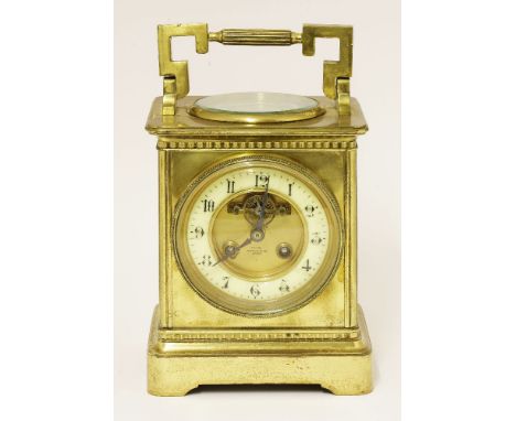 A brass desk clock,with a painted chapter ring, centred with a visual escapement, inscribed '...by Mappin & Webb, London', th