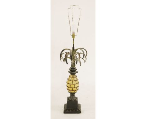 A painted wooden table lamp,in the form of a pineapple with pressed metal leaves on a square plinth, with shade,lamp 83cm hig