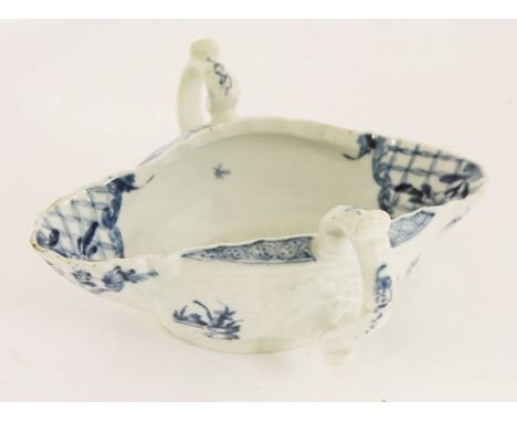 A Worcester blue and white two-handled sauce boat,c.1755, in a silver shape with a painted chinoiserie watery landscape, work