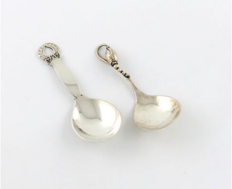 By Georg Jensen, two Danish silver caddy spoons, Blossom and unknown ornamental patterns, the Blossom pattern Copenhagen 1926