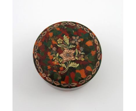 λA late 18th/early 19th century 'scagliola' snuff box, circular form, the pull-off cover inlaid with two-coloured gold and si