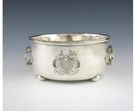 A George IV silver two-handled souffle dish, by John Wrangham and William Moulson, London 1824, circular form, drop-ring hand