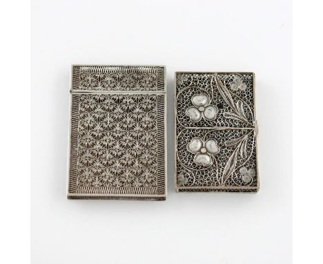 A 19th century silver filigree card case, unmarked, rectangular form, hinged cover, foliate scroll decoration, the front and 