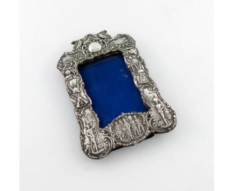 Boer War interest, a Victorian silver photograph frame, by James Deakin and Sons, Chester 1900, shaped upright rectangular fo