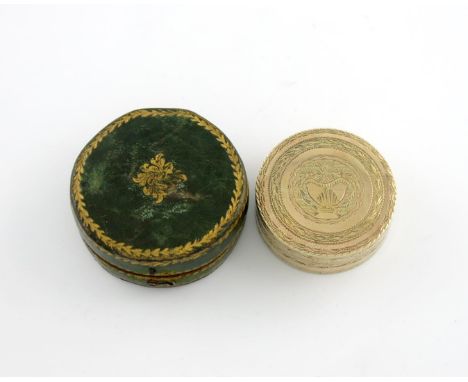 A late 18th century Neapolitan silver-gilt snuff box, with a town mark only, circular form, engraved decoration, with an urn 