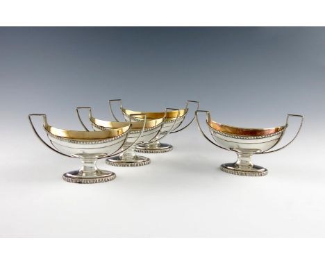 A set of four George III silver salt cellars, by William Abdy, London 1801, oval form, scroll handles, gadroon borders, gilde