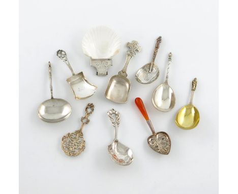 A mixed lot of ten silver caddy spoons, comprising: a late-Victorian one with a heart shaped bowl and agate handle, London 18