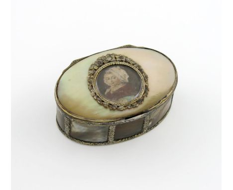 λA silver-gilt and mother-of-pearl portrait snuff box, probably 18th century, oval form, the mounts with chased foliate decor