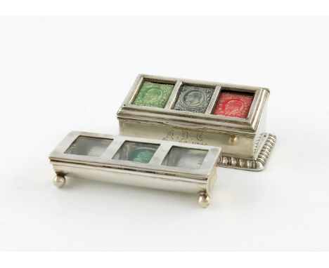 An Edwardian silver triple stamp box, by H. Matthews, Birmingham 1905, rectangular sloping form, with three panels, on a gadr