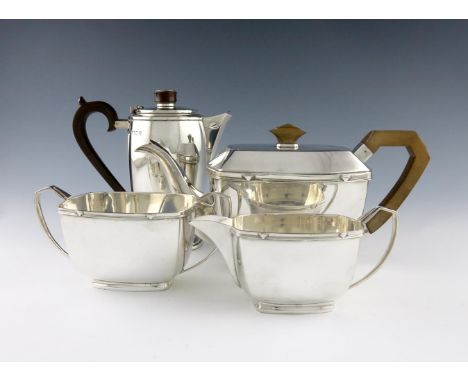 An Art Deco silver hot water pot and a three-piece electroplated tea set, by the Goldsmiths and Silversmiths Company, London 