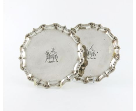 A pair of George II silver waiters, by Francis Pages, London 1735, circular form, moulded borders, the centres with a large c