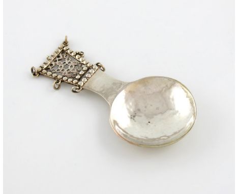 By The Sandheim Brothers, an Arts and Crafts silver caddy spoon, London 1916, circular bowl, spot-hammered decoration, taperi