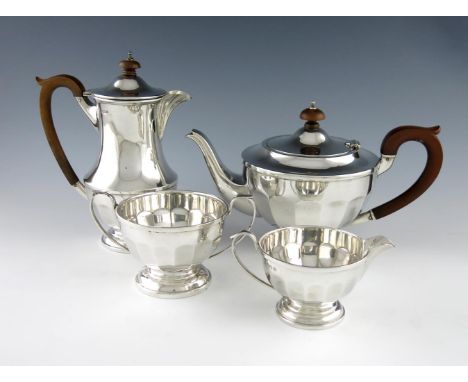 A matched four-piece silver tea set, by Synyer & Beddoes, Birmingham 1936, the hot water pot by H. Clifford Davis, Birmingham