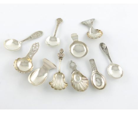 A small collection of ten silver caddy spoons, comprising: one with a fluted bowl and finial modelled as the bust of Shakespe