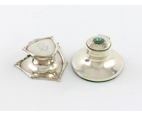 A silver and enamel inkwell, by F. Adams, Birmingham 1910, capstan form, the hinged cover applied with enamel decoration, dia