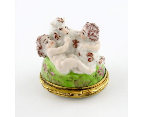 A St James (Charles Gouyn) bonbonniθre, c.1755, modelled with two putti playing with a lamb atop a grassy knoll painted with 