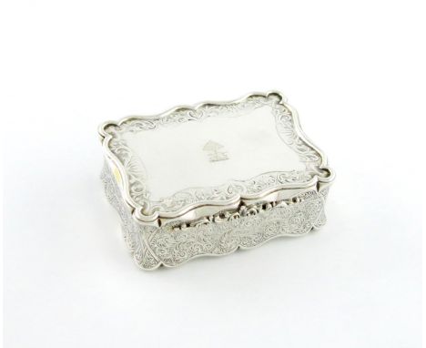 A large Victorian silver table snuff box, by Alfred Taylor, Birmingham 1866, shaped rectangular form, engraved foliate scroll