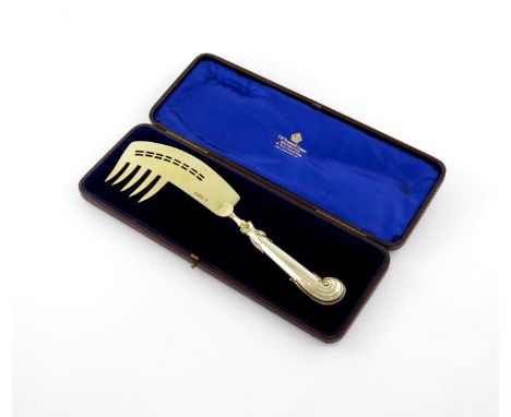 An unusual Victorian silver-gilt serving fork /fish slice, by Holland, Aldewinckle and Slater, London 1900, foliate pistol gr