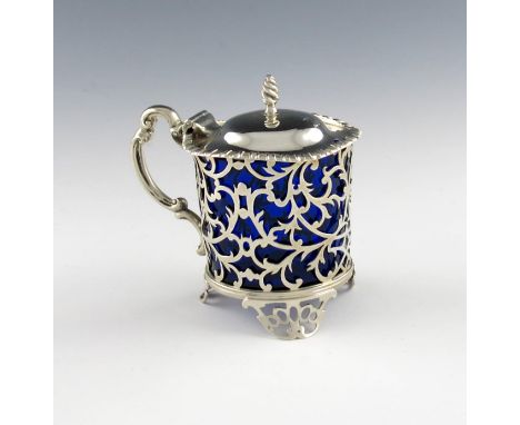 A Victorian silver mustard pot, by Thomas, Henry and Frederick Francis, London 1853, circular form, pierced foliate scroll de