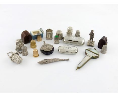 A mixed lot, comprising: a nine carat gold thimble, Birmingham 1953, two unmarked gold thimbles, plus silver items, a commemo