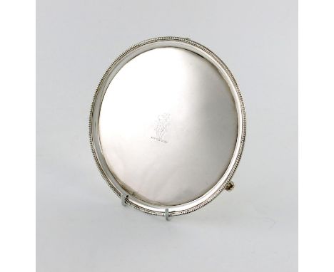 A George III silver waiter, by Hester Bateman, London 1790, circular form, beaded border, the centre with a crest, on three b