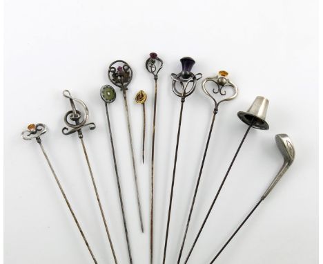 A collection of ten hat pins, comprising: a silver one modelled as a Welsh hat, by Charles Horner, Chester 1909, five further