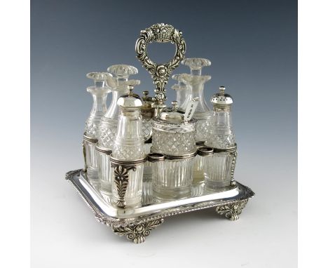 A George IV silver eight bottle cruet frame, by William Elliott, London 1820/1, rectangular form, reeded wire-work frame, cen