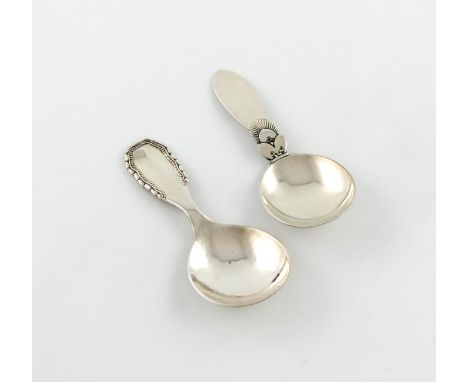 By Georg Jensen, two Danish silver caddy spoons, Cactus and Viking patterns, the Viking pattern Copenhagen 1928, one terminal