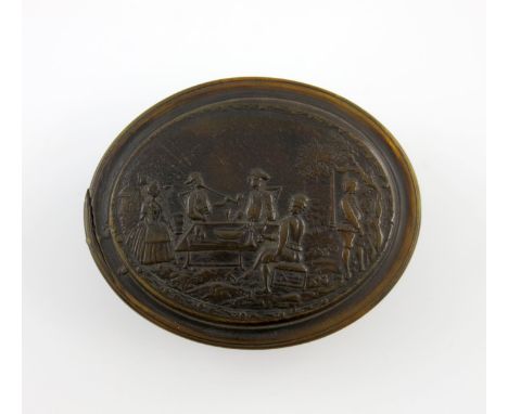 An early 18th century German pressed horn snuff box, signed S.L, for Samuel Lambelet, oval form, the cover pressed with men s
