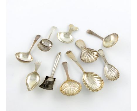 A collection of ten silver caddy spoons, comprising: one with an engraved shovel bowl, by Joseph Taylor, Birmingham 1811, one