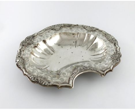 An 18th century Portuguese silver barber's bowl, maker's mark A.I, Lisbon, shaped lobed oblong form, foliate and scroll borde