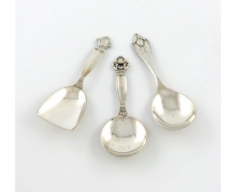 By Georg Jensen, three Danish silver caddy spoons, Acorn, Acanthus, and No.77 patterns, the Acorn pattern with import marks f