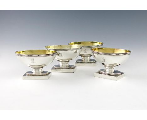 A set of four George III silver salt cellars, by Wakelin and Taylor, London 1779, oval form, gilded bowls, beaded borders, on