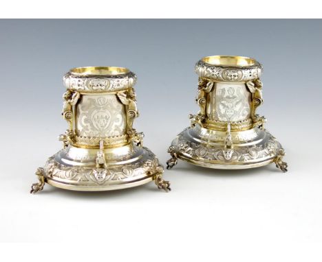 A pair of Victorian silver standing salt cellars, by Henry Curry, London 1870, in the 16th century manner, circular form, wit