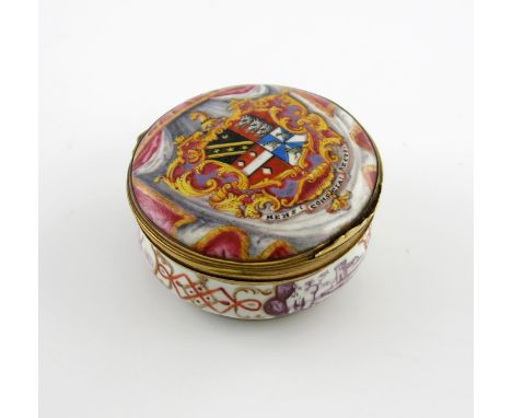 A rare London enamel circular snuff box, c.1740-45, the cover painted with the coat of arms for the Hippesley family, within 