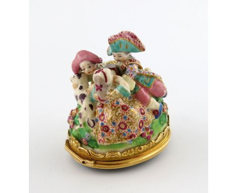 A Chelsea gold-mounted bonbonniθre, c.1760, modelled as three children and a dog playing on a grassy mound, the girl covering