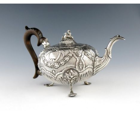 A late 18th / early 19th century Portuguese silver teapot, maker's mark DM, Lisbon circa 1800, circular form, embossed with m